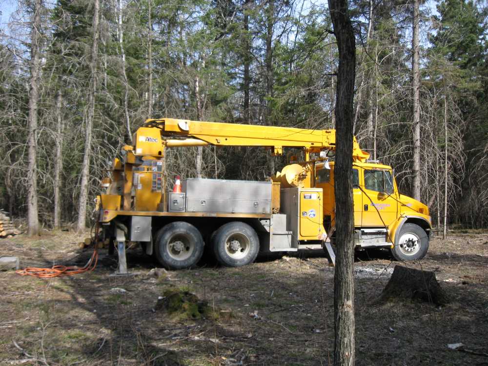 Naturist Legacy History: Gallery 08/02...Hydro installs power line poles